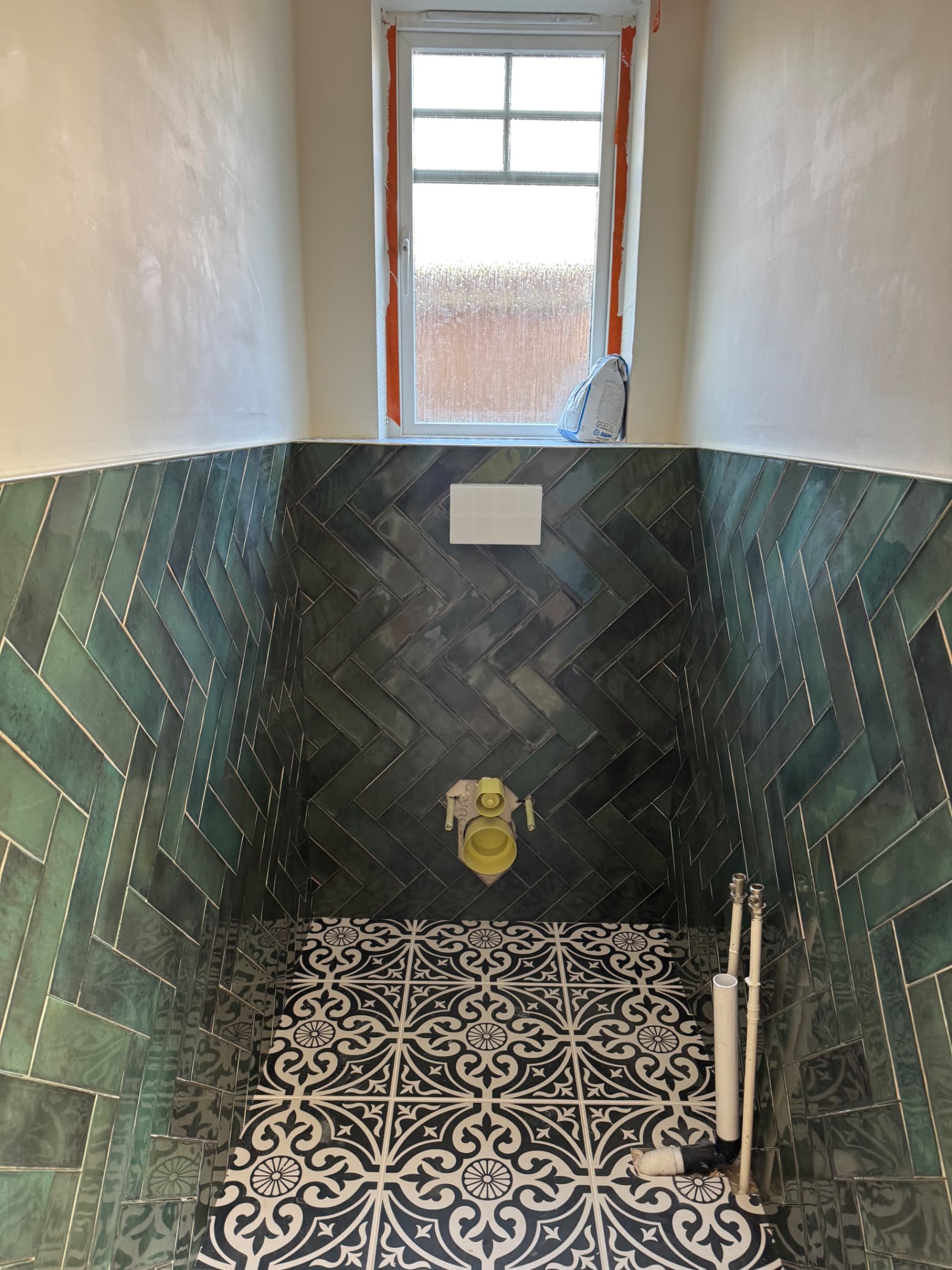 Herringbone feature wall in a Wokingham downstairs toilet