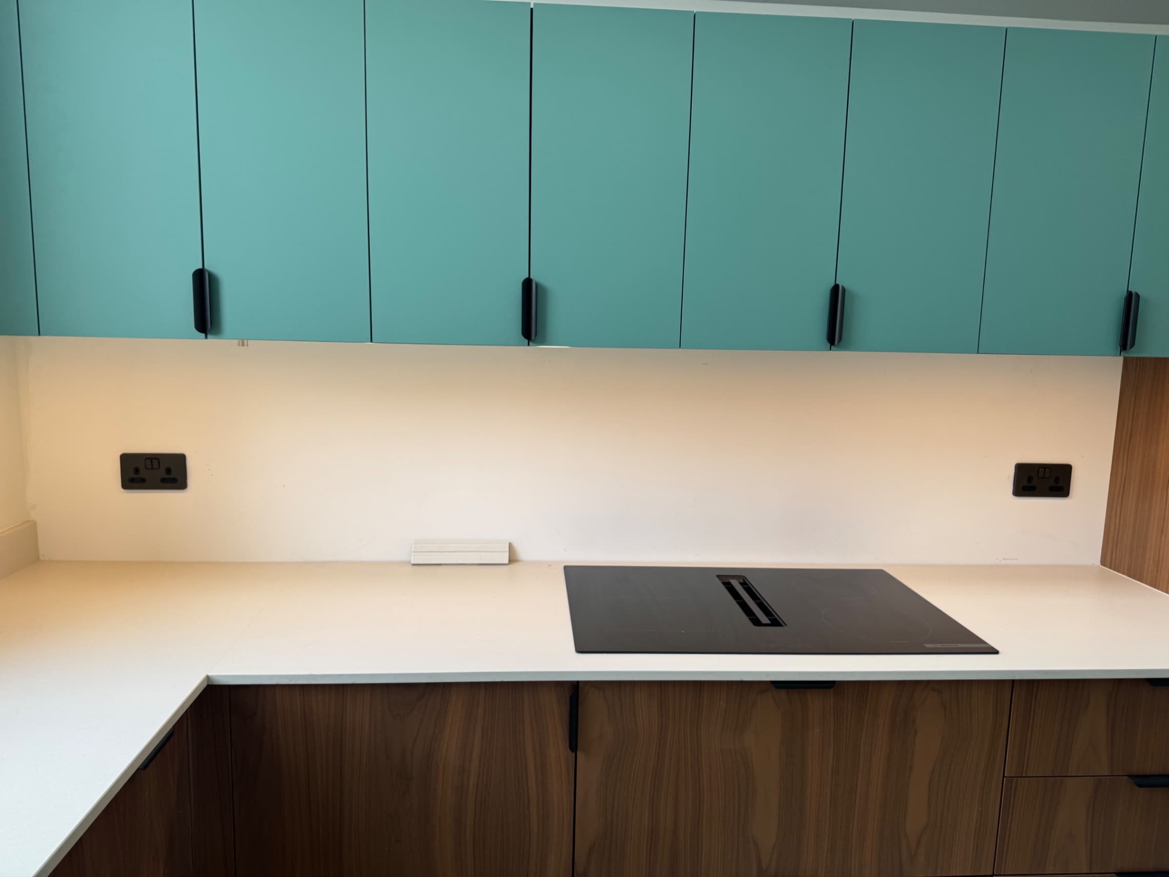 The customer has opted for a tiled splashback instead of the current painted walls. We’re about to prime the surface ready for tiling.