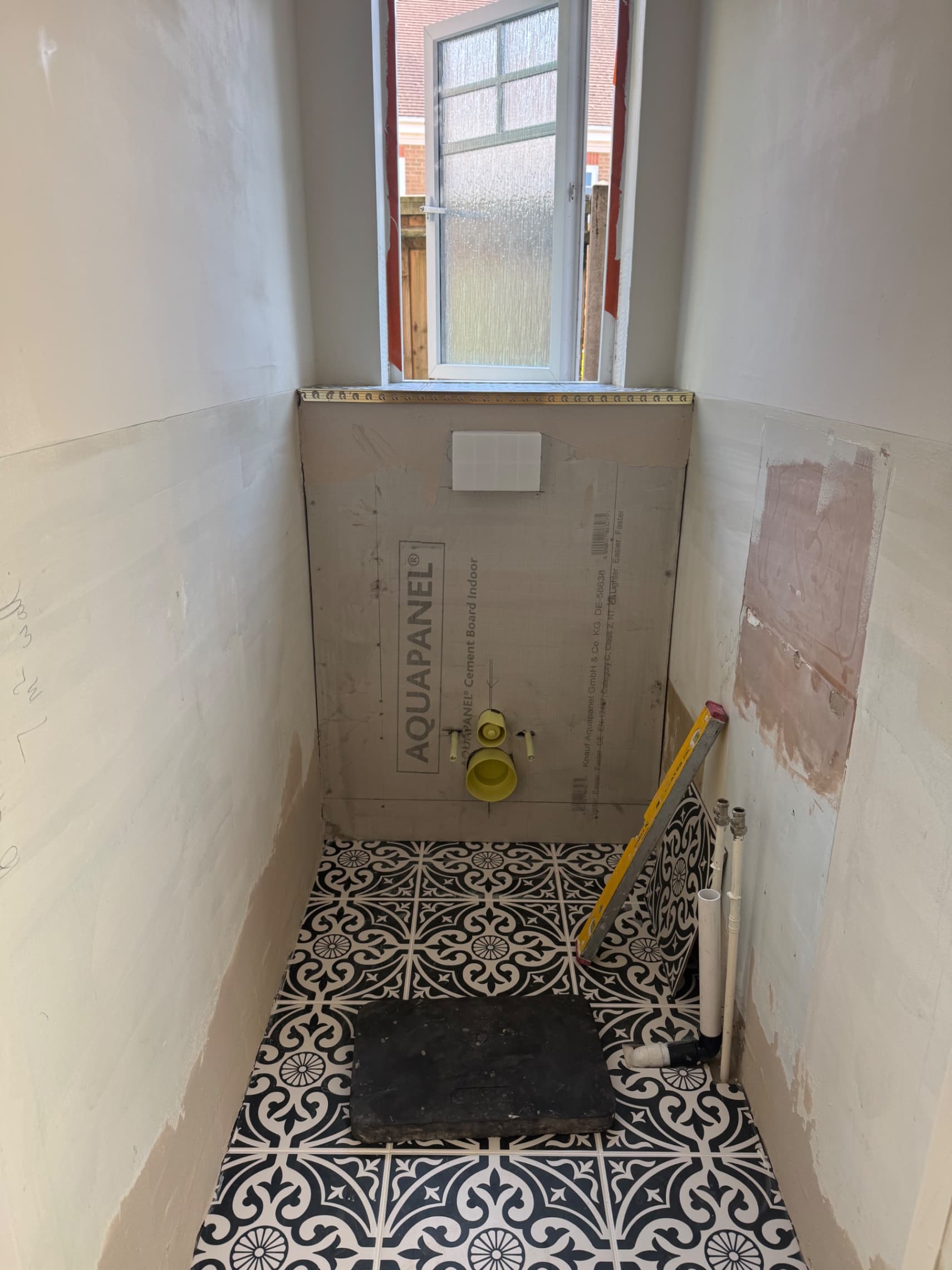 Herringbone feature wall in a Wokingham downstairs toilet